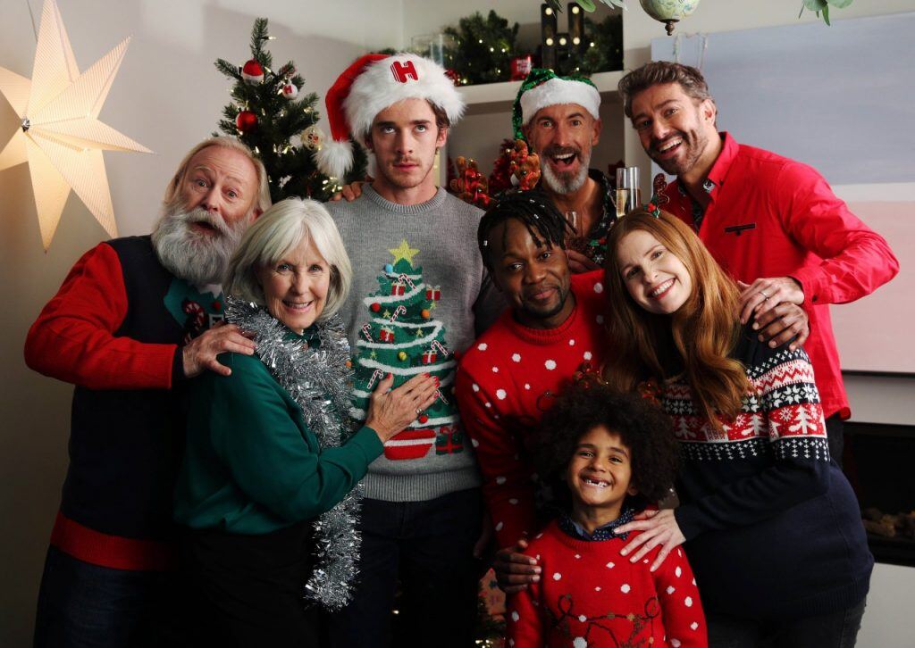 Image of family having fun, except for the millennial who's miserable. 